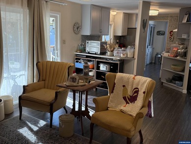 Nicely updated home w/new LVP flooring, metal roof, updated