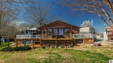 Located on main channel of Kentucky Lake, this spacious home - photo 1