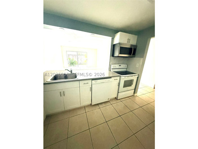 Rarely available !st. floor corner unit with a large patio in - photo 4
