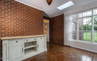 A picturesque tree-lined driveway welcomes you home, setting the - photo 15