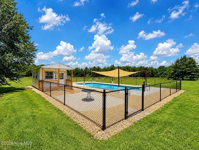 A picturesque tree-lined driveway welcomes you home, setting the - photo 32