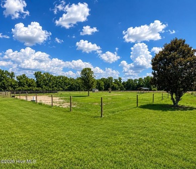 A picturesque tree-lined driveway welcomes you home, setting the - photo 33