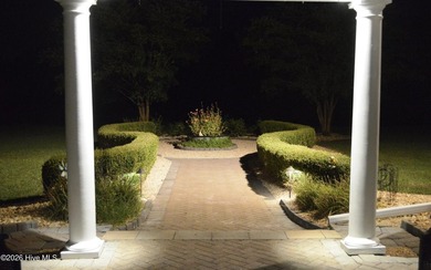 A picturesque tree-lined driveway welcomes you home, setting the - photo 38