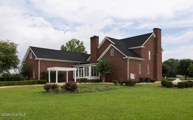 A picturesque tree-lined driveway welcomes you home, setting the - photo 40