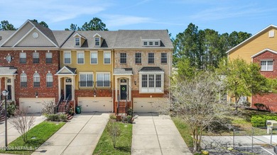 Welcome to this stunning end-unit, three-story townhouse in the - photo 3