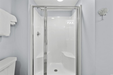 Discover your coastal oasis in this charming second-row condo