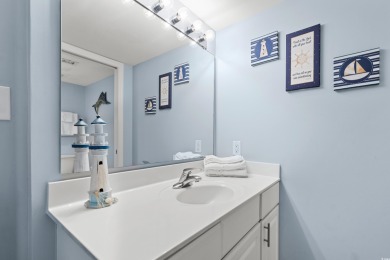 Discover your coastal oasis in this charming second-row condo