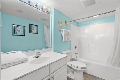 Discover your coastal oasis in this charming second-row condo