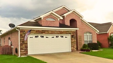 Tour this well-maintained 3BR/2BA custom brick home located in