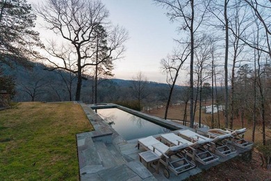 A 280-foot canyon drop from mountain ridge to river, anchored by - photo 7