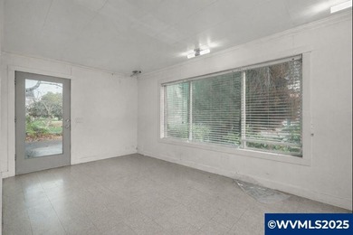 Opportunity knocks in Salem! Situated on a generous .25-acre lot