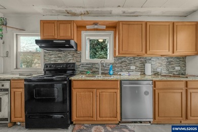 Opportunity knocks in Salem! Situated on a generous .25-acre lot