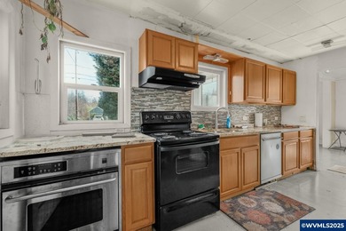 Opportunity knocks in Salem! Situated on a generous .25-acre lot