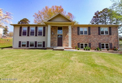 Welcome home to this spacious 5BR/3BA split foyer on a level lot - photo 1