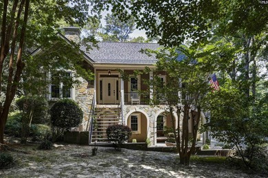 Nestled among nearly two acres of mature old-growth hardwoods in - photo 3