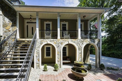 Nestled among nearly two acres of mature old-growth hardwoods in - photo 4