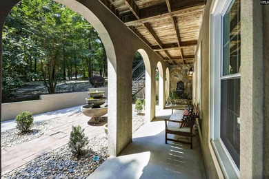 Nestled among nearly two acres of mature old-growth hardwoods in - photo 5