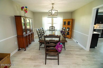 Welcome home to this spacious 5BR/3BA split foyer on a level lot - photo 5