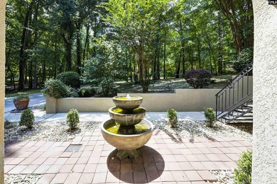 Nestled among nearly two acres of mature old-growth hardwoods in - photo 6