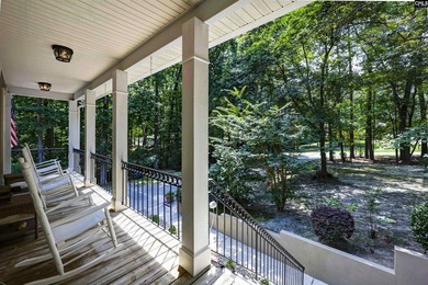 Nestled among nearly two acres of mature old-growth hardwoods in - photo 7