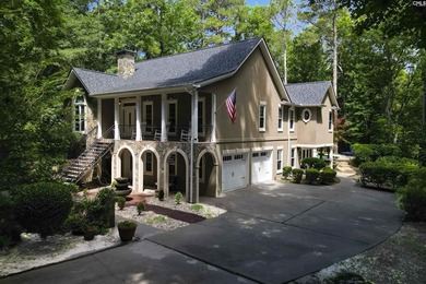 Nestled among nearly two acres of mature old-growth hardwoods in - photo 8