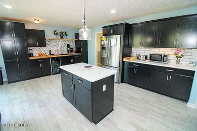 Welcome home to this spacious 5BR/3BA split foyer on a level lot - photo 8