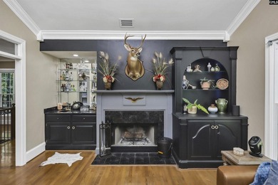 Nestled among nearly two acres of mature old-growth hardwoods in - photo 9
