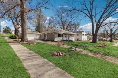 Situated on a .26-acre corner lot with mature surroundings, this