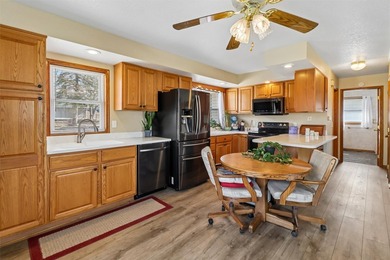 Situated on a .26-acre corner lot with mature surroundings, this