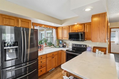 Situated on a .26-acre corner lot with mature surroundings, this