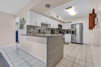 Location is everything! This 3-bedroom, 2-bath condo in Windwood - photo 10