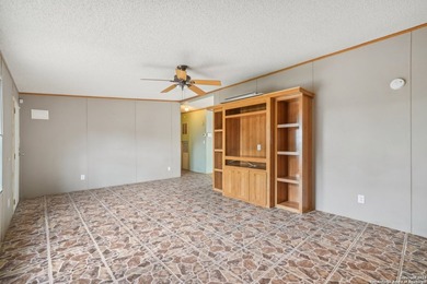 Set on over 1.3 acres in Lakehills, Texas, this 4-bedroom - photo 4