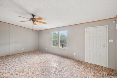 Set on over 1.3 acres in Lakehills, Texas, this 4-bedroom - photo 5