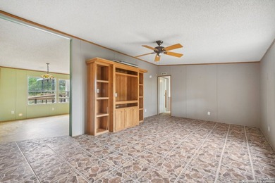 Set on over 1.3 acres in Lakehills, Texas, this 4-bedroom - photo 6
