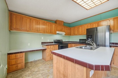 Set on over 1.3 acres in Lakehills, Texas, this 4-bedroom - photo 10