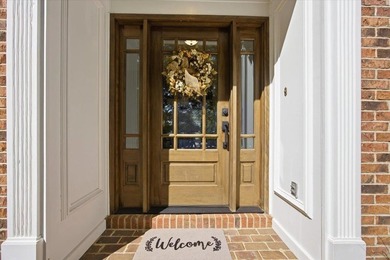 Tucked away on a quiet cul-de-sac in the gated community of the - photo 3