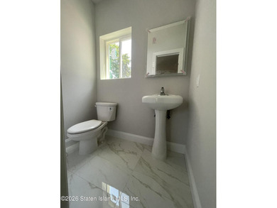 A unique gem! Gorgeous 2 family new construction. This - photo 16