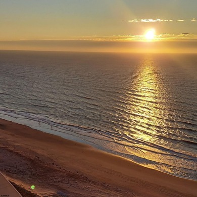 This beautiful condo features stunning views of the beach, ocean