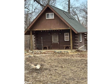 This rustic log a-frame is versatile: a great summer cabin or - photo 3