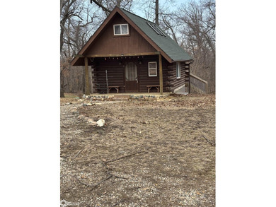 This rustic log a-frame is versatile: a great summer cabin or - photo 4