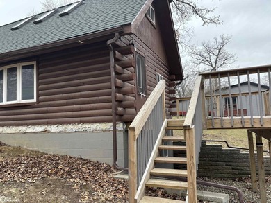 This rustic log a-frame is versatile: a great summer cabin or - photo 7