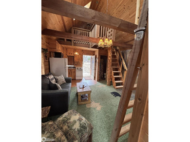 This rustic log a-frame is versatile: a great summer cabin or - photo 9
