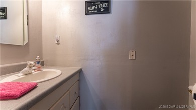 Lakefront living in the heart of Osage Beach at the 21MM! This