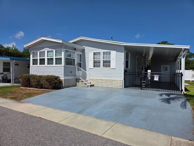 This 2 bed 2 bath 2012 home is located in Teakwood Village a 5 - photo 1