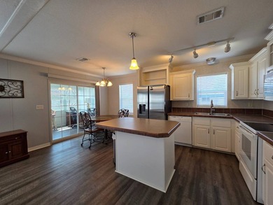 This 2 bed 2 bath 2012 home is located in Teakwood Village a 5 - photo 3