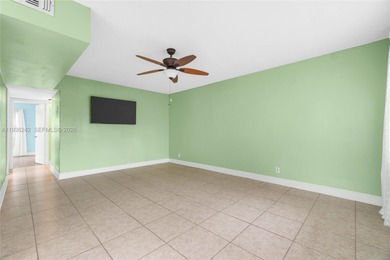 Desirable 1st floor- corner unit (only one neighbor) with