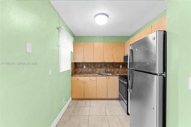 Desirable 1st floor- corner unit (only one neighbor) with