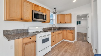 Welcome to this charming manufactured home featuring 2 bedrooms