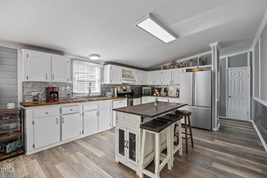 Welcome to this 4-bedroom, 2-bathroom manufactured home situated - photo 25
