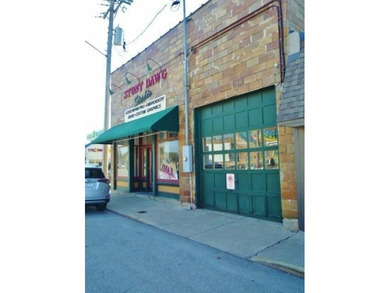 Located in downtown Rensselaer with green awnings highlighting - photo 1
